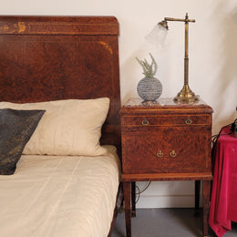 French Art Deco bedroom suite consisting of queen size bed in Amboyna wood and featuring pretty inlay. It comes with a matching pair of bedsides. It is a very stylish and high quality suite. It has been sourced from France and is in good original detailed condition.