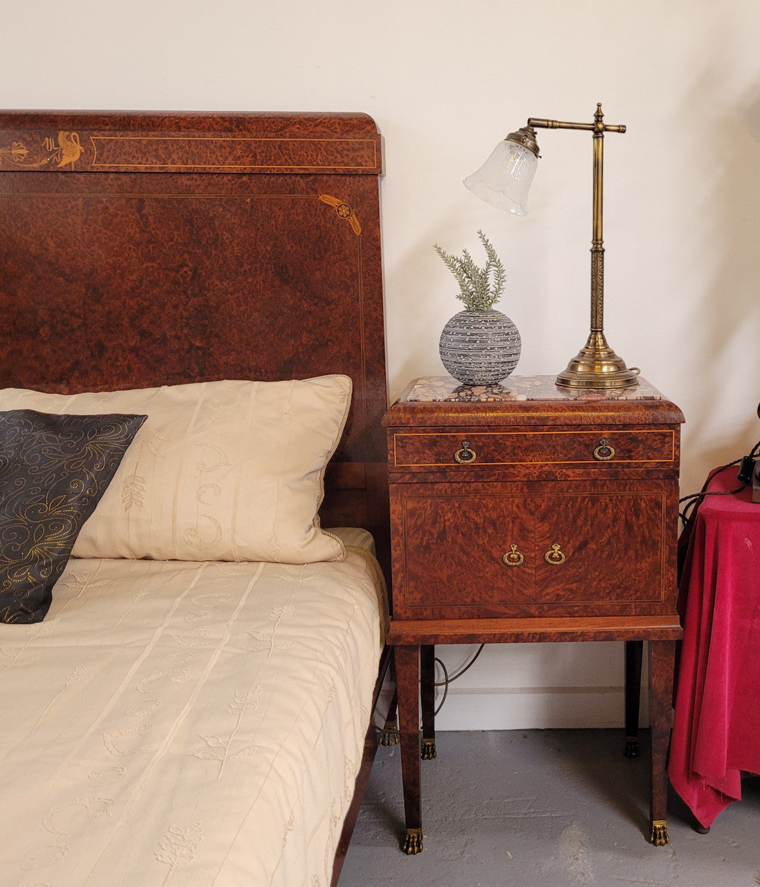 French Art Deco bedroom suite consisting of queen size bed in Amboyna wood and featuring pretty inlay. It comes with a matching pair of bedsides. It is a very stylish and high quality suite. It has been sourced from France and is in good original detailed condition.