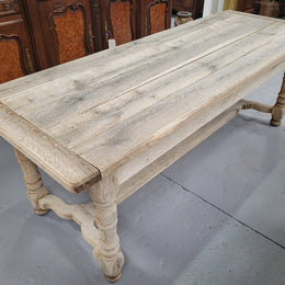 French stripped Oak pedestal stretcher base Farmhouse table with two drawers on either side of table. Features raw wood that could be used as is for a distressed look, or finished and waxed for a more refined look.