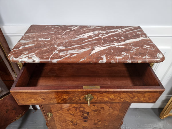 Elegant French transitional style Walnut & Kingwood Salon cabinet. It has beautiful marquetry inlay, a marble top and decorative ormolu mounts. Sourced From France and is in good original detailed condition.
