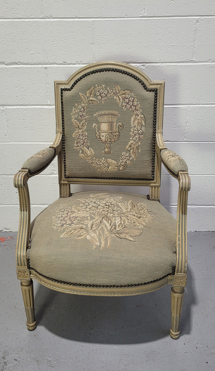 Lovely Louis XVI style painted fauteuil with lovely sage coloured tapestry upholstery. In good original condition.