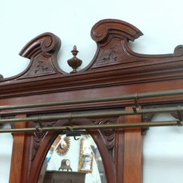 French mahogany hall stand with a marble top drawer. It has beautiful large brass hooks and fittings. It is in very good original detailed condition.
