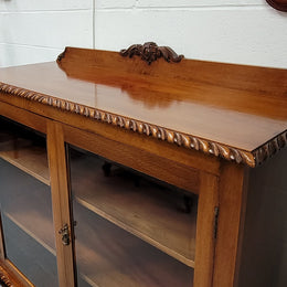 Chippendale style Mahogany two door bookcase. It has bevelled glass doors and two adjustable shelves. It has been sourced locally and is in good original detailed condition.