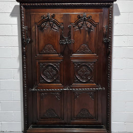 French Henry II 19th century narrow proportioned Walnut hall stand. Full of Character with stunning hand forged wrought iron hooks and interesting carvings. In good original detailed condition.