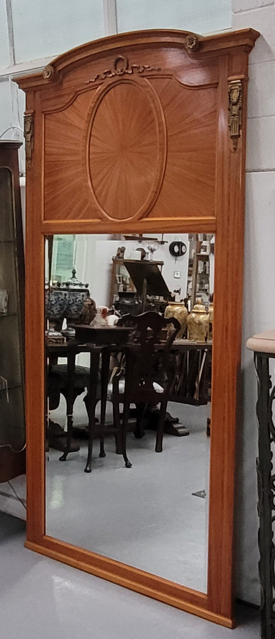 Stunning long Louis XV style satinwood Trumeau mirror decorated with Bronze ormolu mounts. It has its original bevelled mirror and it in good detailed condition. It has been sourced from France.
