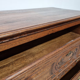 Early 19th Century French Oak chest of three drawers. It has beautiful handles and carvings. It is in good original detailed condition.