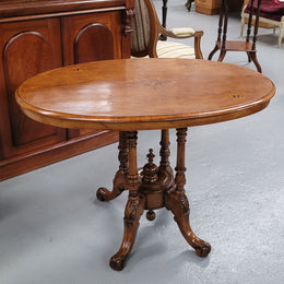 Victorian Walnut oval beautifully inlaid occasional table with bird cage undercarriage. It is in good original detailed condition and it has been sourced locally.