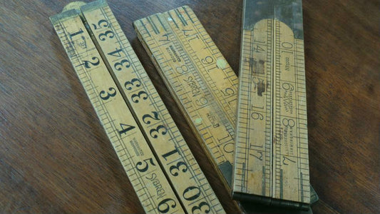 A vintage boxwood rulers in inches. There are two that measure to 24 inches, one measures and 36 inches and all in good condition. Note, price is for each one.