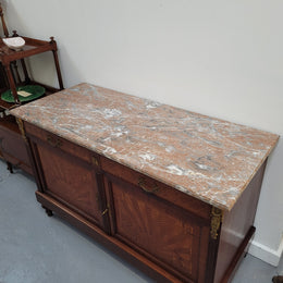 Louis 16th style Mahogany marble top cupboard and two drawers with decorative marquetry inlay and gilt bronze mounts. In good original detailed condition.
