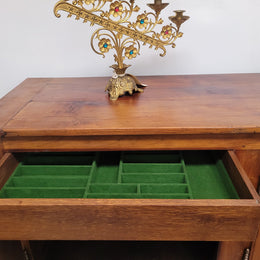 Early 19th Century Louis XV style Fruitwood three door sideboard. It has three hidden internal drawers and one of them has green valet and small sections for cutlery. It is in good restored condition.