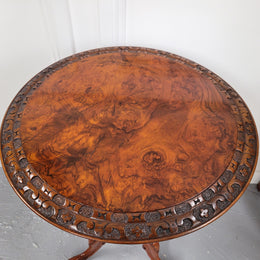Rare early Victorian Irish Burr Walnut wine table. It has a beautiful carvings and a stunning burr walnut top, on a barley twist column and three shaped legs. It has been sourced locally and is in good original detailed condition. We also have a second table being sold separately which when together make a matched pair.