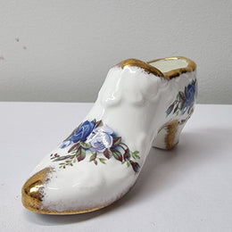A lovely pair of Royal Albert China shoes in good original condition. Stamped on the sole 'Moonlight Rose: Royal Albert Bone China, England ©1987.