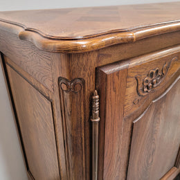 French Oak Louis XV style three door, two drawer, parquetry top sideboard. It has been sourced from France and is in good restored condition.