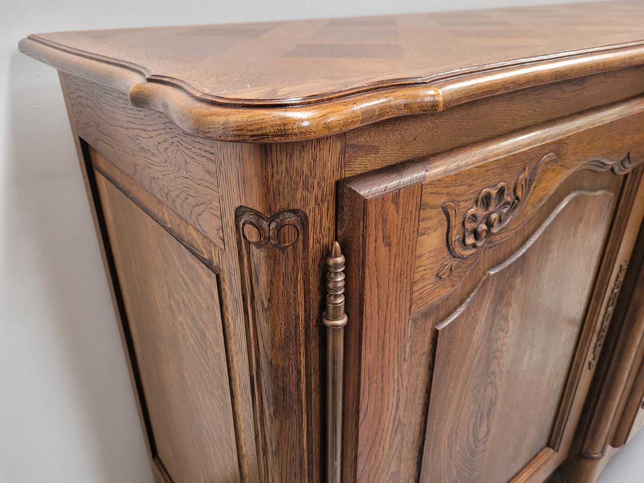 French Oak Louis XV style three door, two drawer, parquetry top sideboard. It has been sourced from France and is in good restored condition.