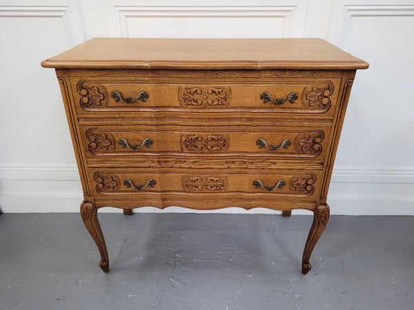 French Oak Louis 15th style nicely carved three drawer wooden top commode. It has been sourced from France and is in good original detailed condition.