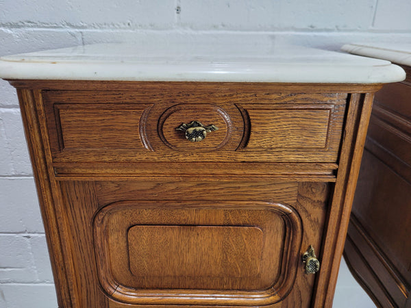 Pair of Louis XV style bedside cabinets with beautiful marble tops and one drawer and single cupboard for all your storage needs. In good original detailed condition.