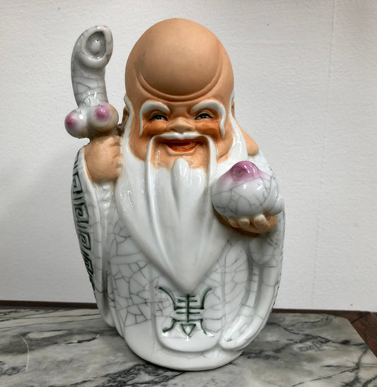Vintage Chinese Immortal figurer of Sau holding a peach.