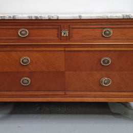 Louis XVI style Mahogany marble top cupboard. It has two drawers at the top and two doors at the bottom all with decorative handles and mounts. Stunning white marble top and all in good original detailed condition.