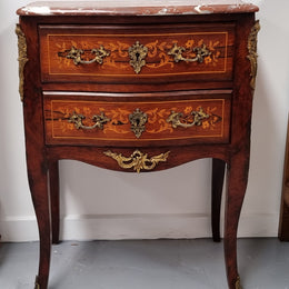 A stunning French petite two drawer inlaid Rosewood commode. In good original detailed condition.