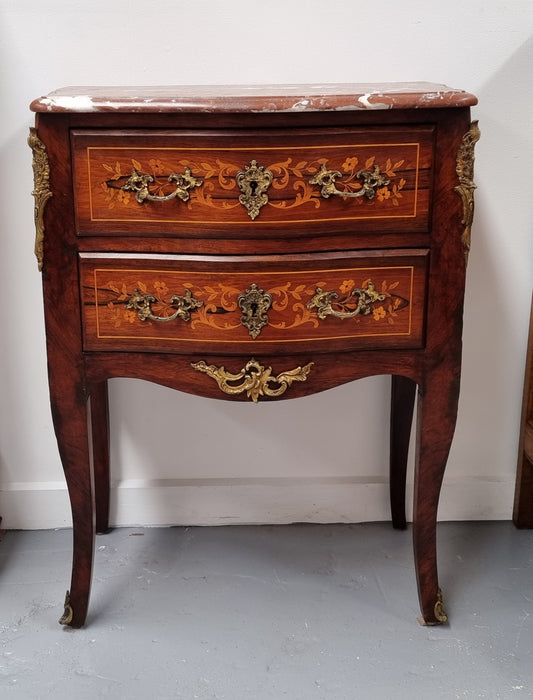 A stunning French petite two drawer inlaid Rosewood commode. In good original detailed condition.