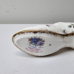 A lovely pair of Royal Albert China shoes in good original condition. Stamped on the sole 'Moonlight Rose: Royal Albert Bone China, England ©1987.