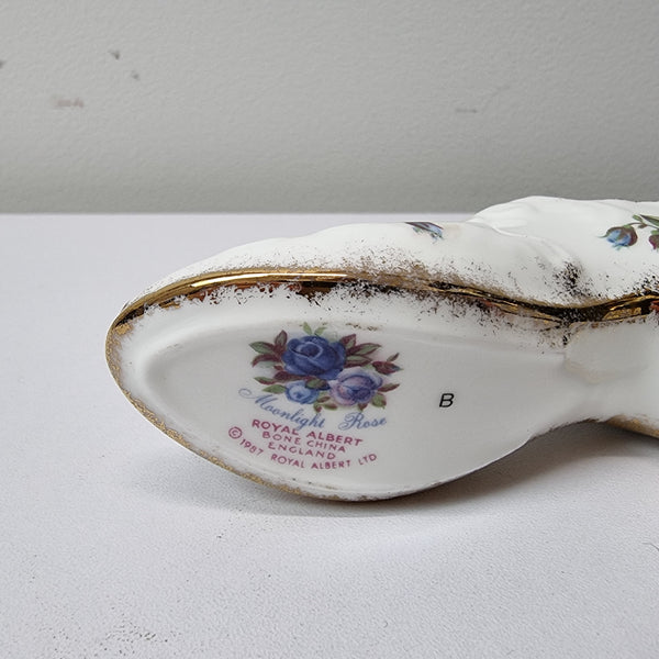 A lovely pair of Royal Albert China shoes in good original condition. Stamped on the sole 'Moonlight Rose: Royal Albert Bone China, England ©1987.