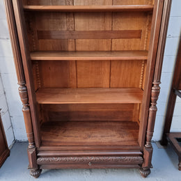 Henry II style 19th century walnut open bookcase with drawer which was originally an armoire now converted to a bookcase. It comes with four adjustable shelves. Is in good detailed condition.