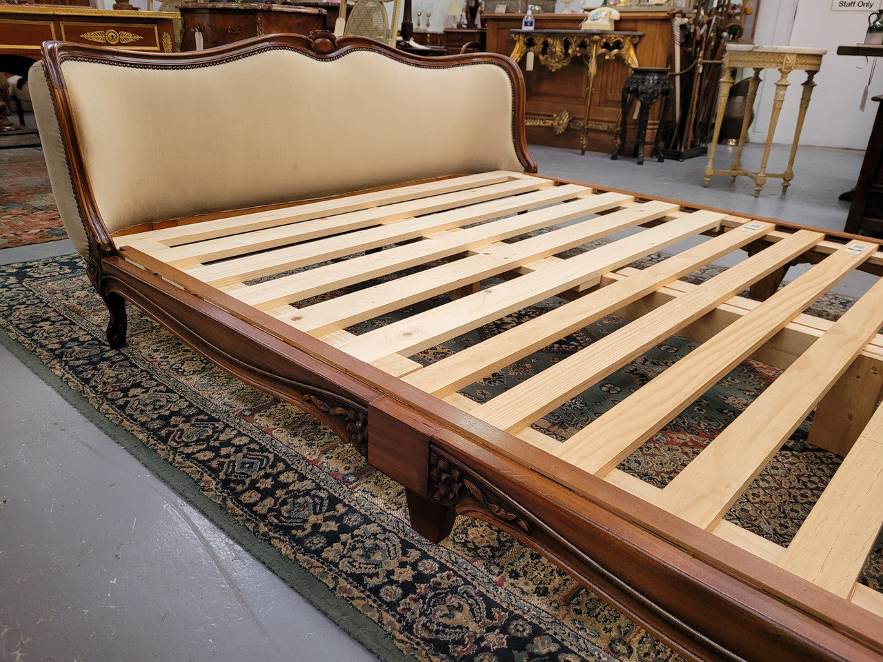 French Louis XV style queen size upholstered bed. Upholstery is in good condition and bed is complete with custom made slats. Just place your mattress on top.