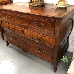 Beautiful 18th Century French all Cherrywood three drawer commode with beautiful ormolu mounts and handles. It is in good original detailed condition.