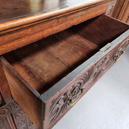 Impressively carved 18th Century English Oak kitchen dresser in 17th Century Jacobean style. It is in good original detailed condition and has been sourced from France.