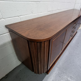 Amazing French Walnut Art deco four door buffet. The doors either side open to a fixed shelf and plenty of added storage with four drawers. In good original detailed condition.