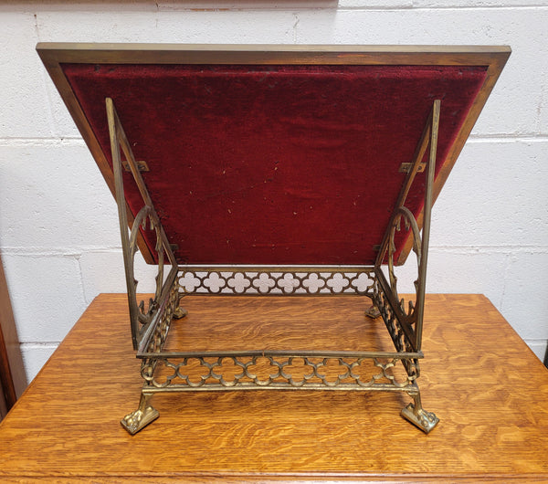 Antique French brass Gothic Revival book stand with red velvet. It has sourced from France and is in good original condition.