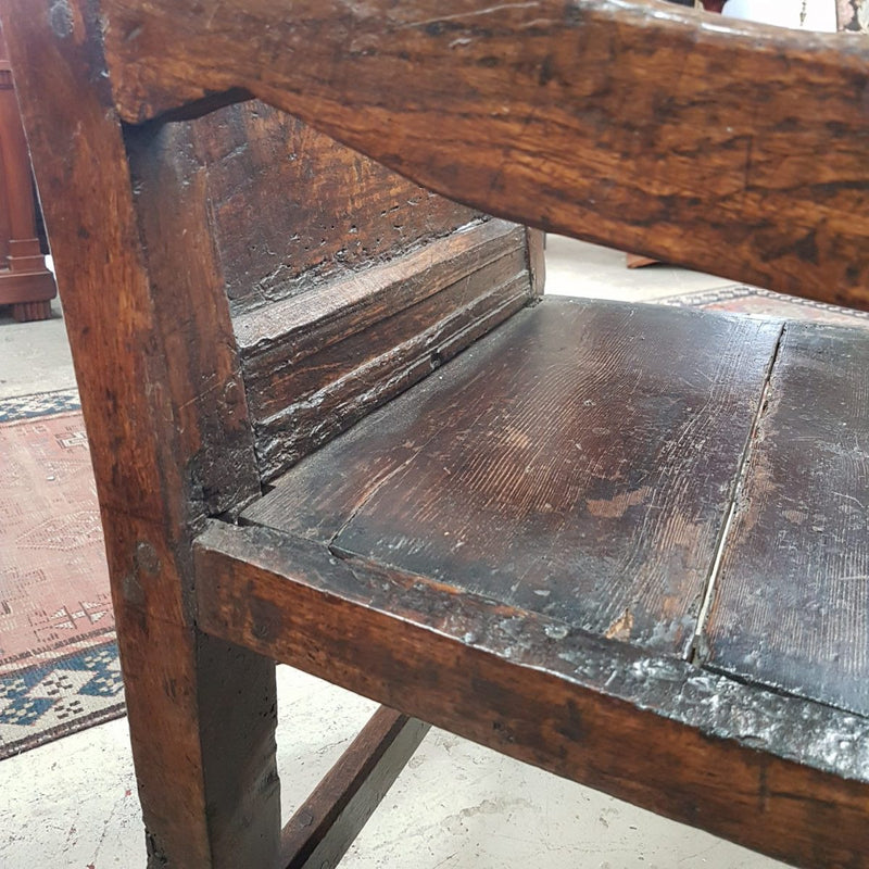 An impressive late 17th century oak, Charles II Wainscot chair, with all original panel timber, solid seat, turned arm supports and original top carved panel. This chair retains it's beautiful patina and comes with upholstered cushion seat.