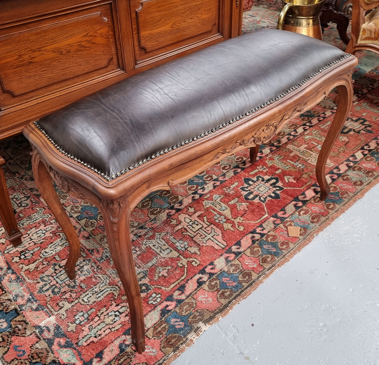 Impressive French Louis 15th style walnut upholstered duet leather stool. Very Good Condition.  Circa: 1930’s, sourced in France.