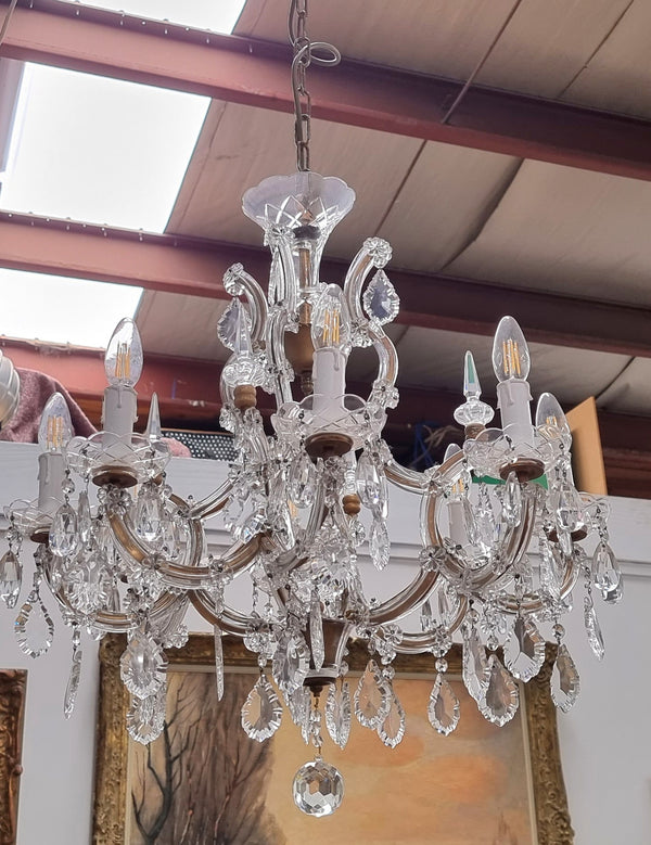 Sourced From France an attractive eight arm French crystal chandelier. It has been fully rewired to Australian standards and is in good original working condition.