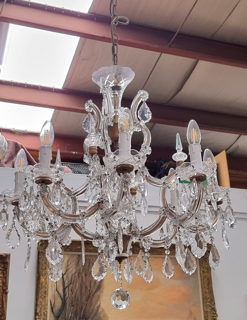 Sourced From France an attractive eight arm French crystal chandelier. It has been fully rewired to Australian standards and is in good original working condition.