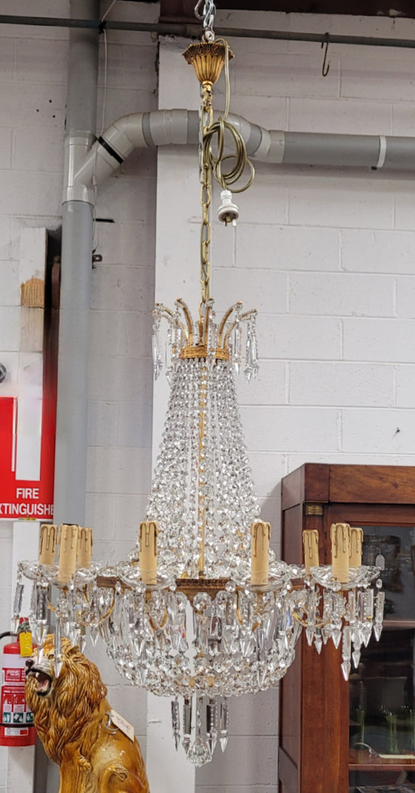 Fine French Empire basket shaped crystal chandelier. Consisting of ten exterior arms and four interior lights. It has stunning crystal's with prism drops. It has been sourced from France fully rewired to Australian standards.