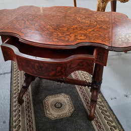 Fabulous marquetry inlaid side table with marquetry extensions and one drawer. Stunning side table or small ladies desk.