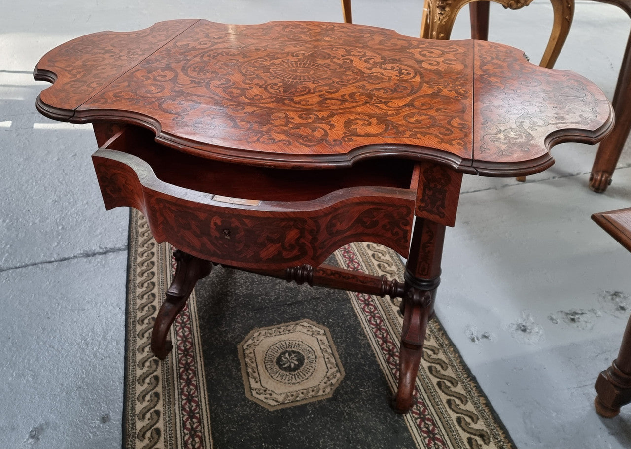 Fabulous marquetry inlaid side table with marquetry extensions and one drawer. Stunning side table or small ladies desk.