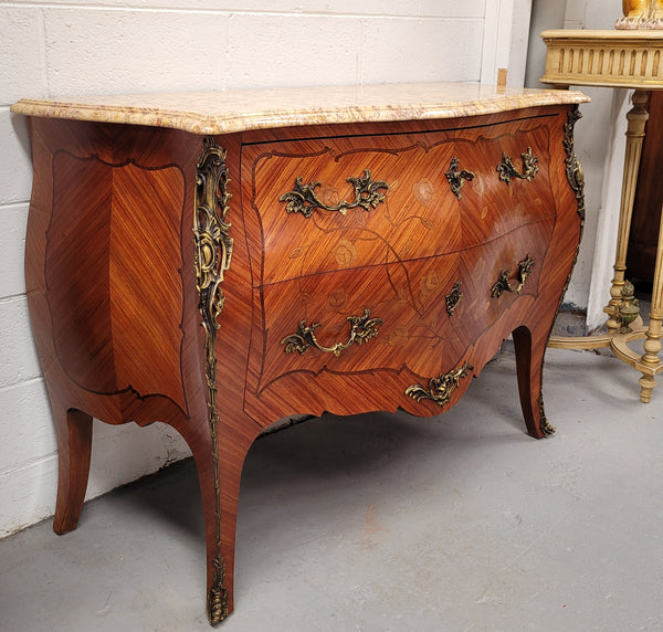 Stunning Louis XV style two drawer marquetry inlaid marble top commode. Made from Kingwood and has highly decorative beautiful ormolu mounts. It has been sourced from France and is in good original detailed condition.