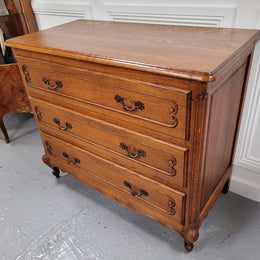 French Louis 15th style Oak three drawer chest of drawers with wooden top. It has been sourced from France and is in good original detailed condition.