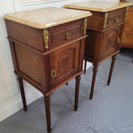 French Oak pair of Louis 16th style marble top bedsides with stunning bronze mounts. They have been sourced from France and are in good original detailed condition.
