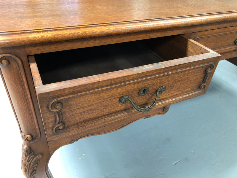 French Oak Louis XV style full partners desk with both sides having five functional drawers. In very good original detailed condition.