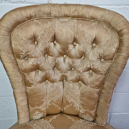 Vintage round upholstered button back bedroom chair. Beautiful gold upholstery in original condition with a gold fringe. original condition.