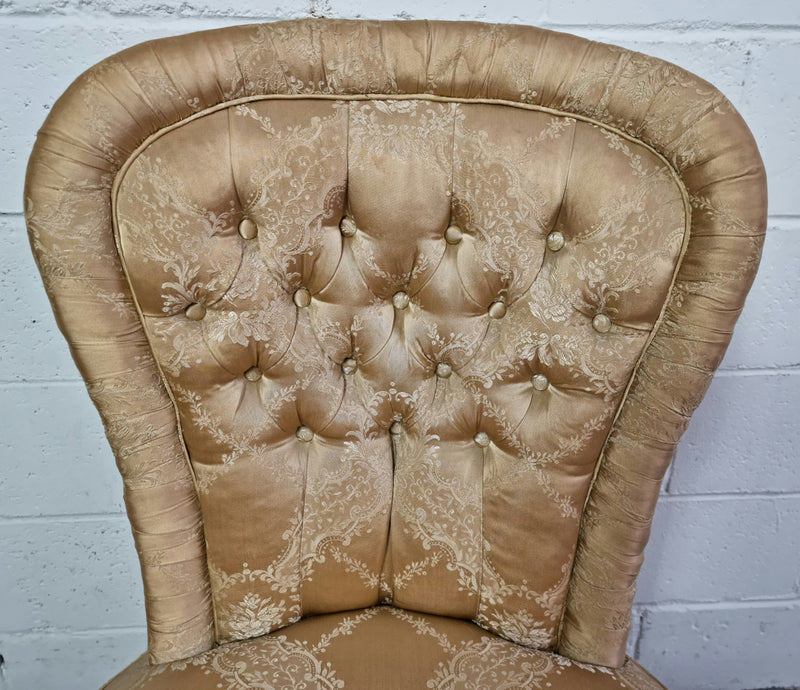 Vintage round upholstered button back bedroom chair. Beautiful gold upholstery in original condition with a gold fringe. original condition.