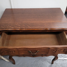 French Oak Louis XV style three drawer commode. It has been sourced from France and has decorative handles and carvings. It is in good original detailed condition.