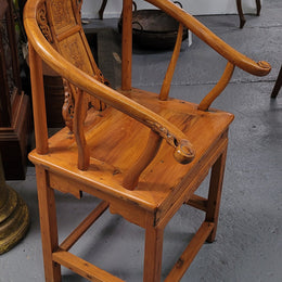 Lovely Chinese Elm horseshoe chair, featuring stunning carving and it is in good original detailed condition.