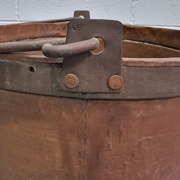 Large Antique French copper cauldron with metal band around rim. It is in good original condition.