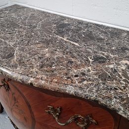 Beautiful French walnut Louis XV style two drawer commode. With a lovely floral marquetry inlaid design and marble top. It is in good original detailed condition.