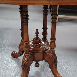 Victorian Walnut oval beautifully inlaid occasional table with bird cage undercarriage. It is in good original detailed condition and it has been sourced locally.
